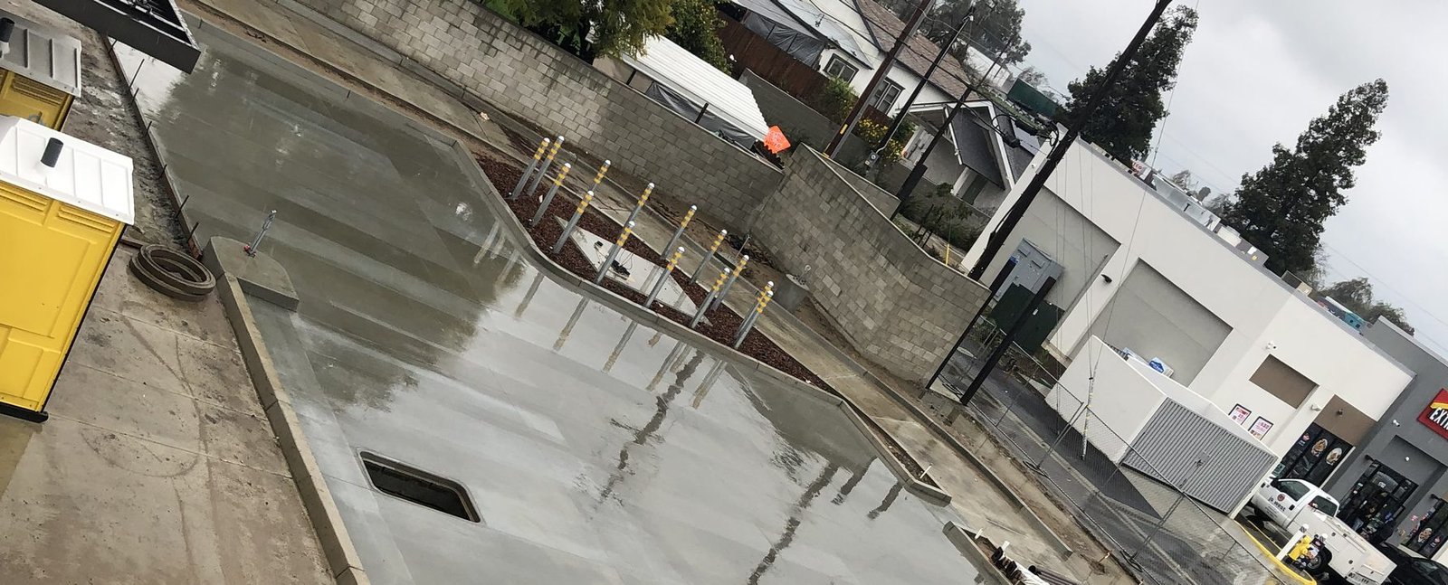 Concrete wash lane slab with drainage