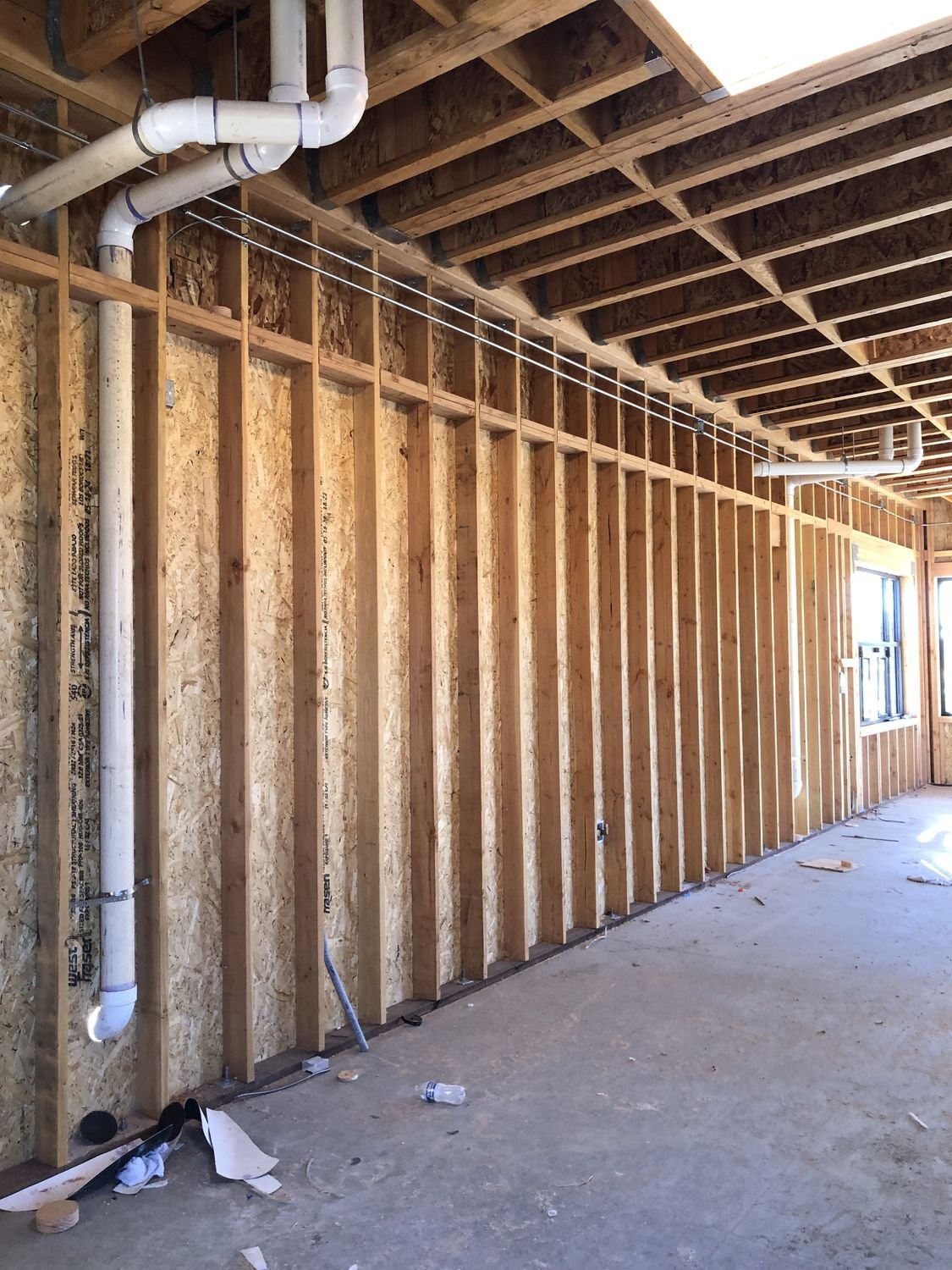 Plumbing rough-in inside the building framing