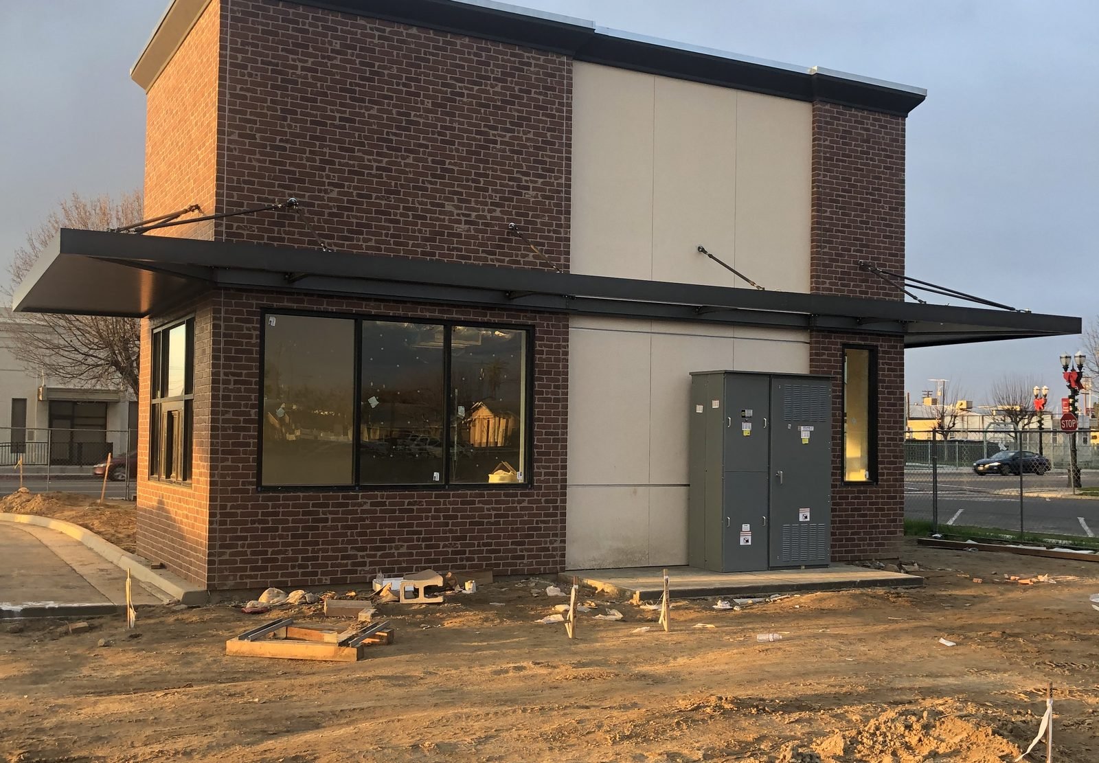 Two-storey commercial shell at dusk