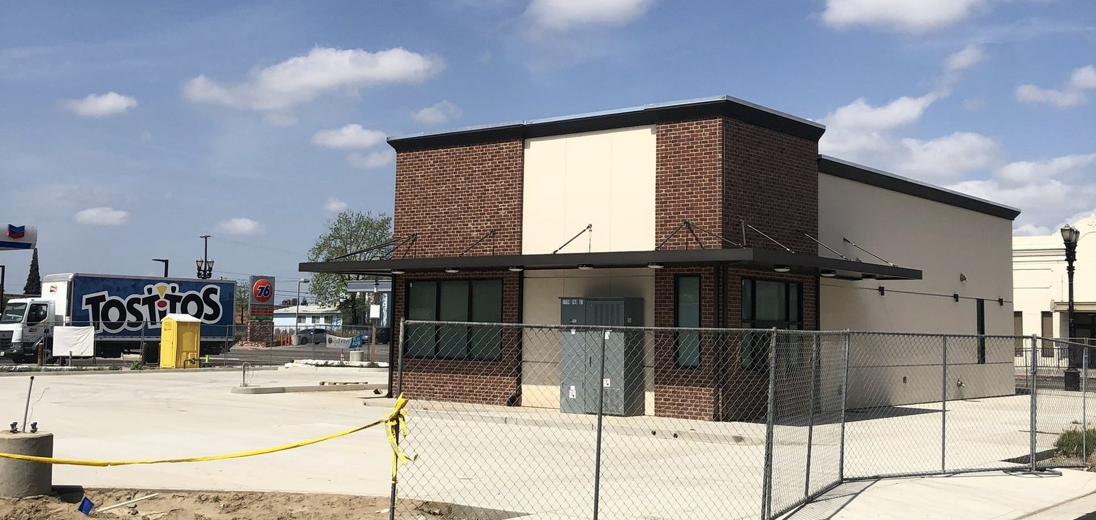 Completed retail building and forecourt