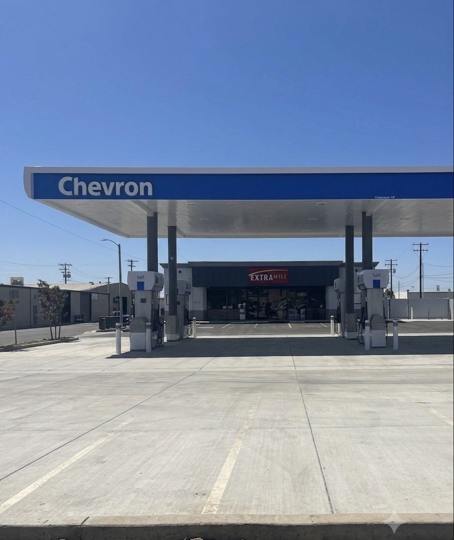 Chevron canopy over a finished concrete forecourt