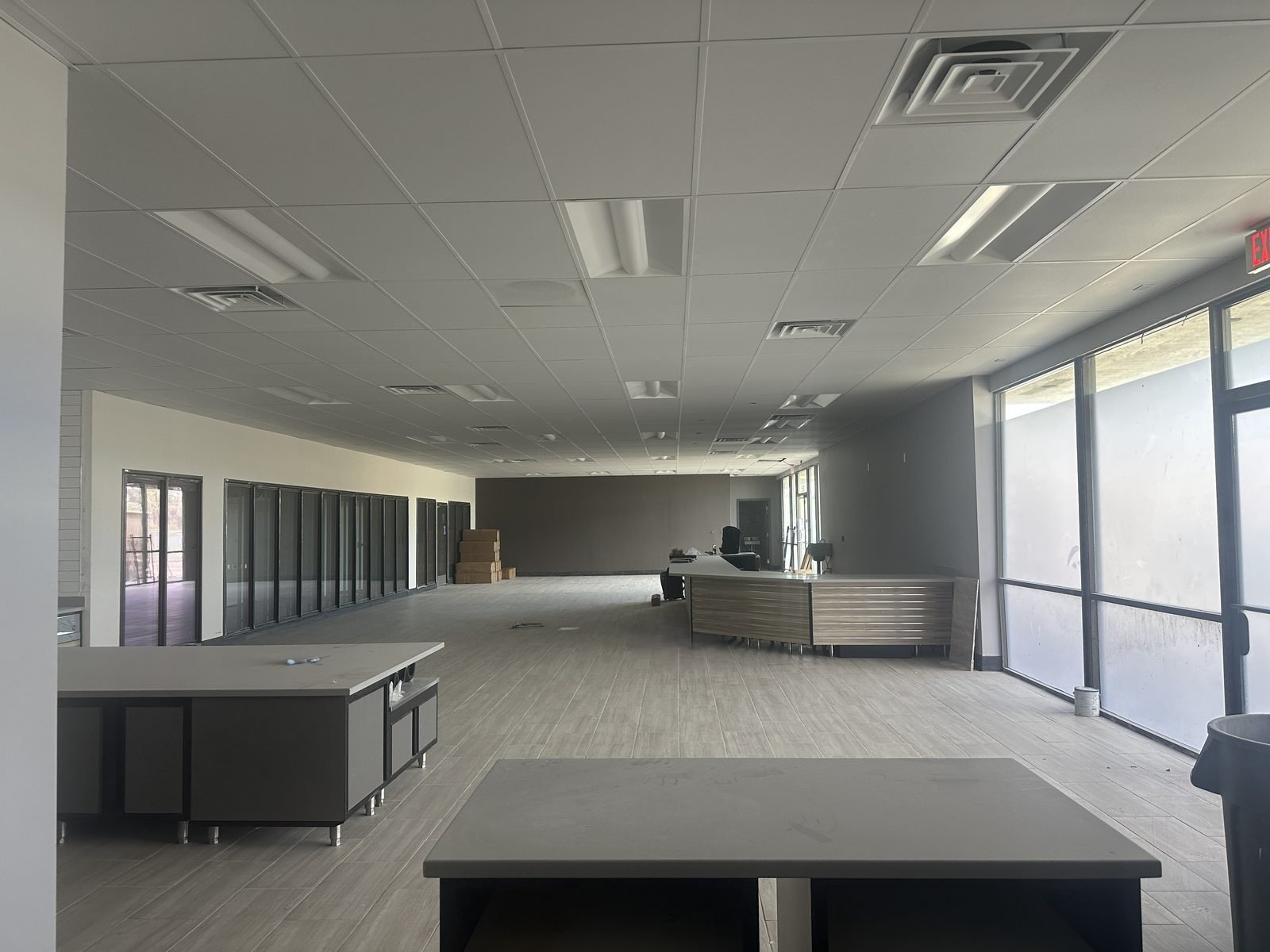 Completed retail interior with service counter and ceiling grid