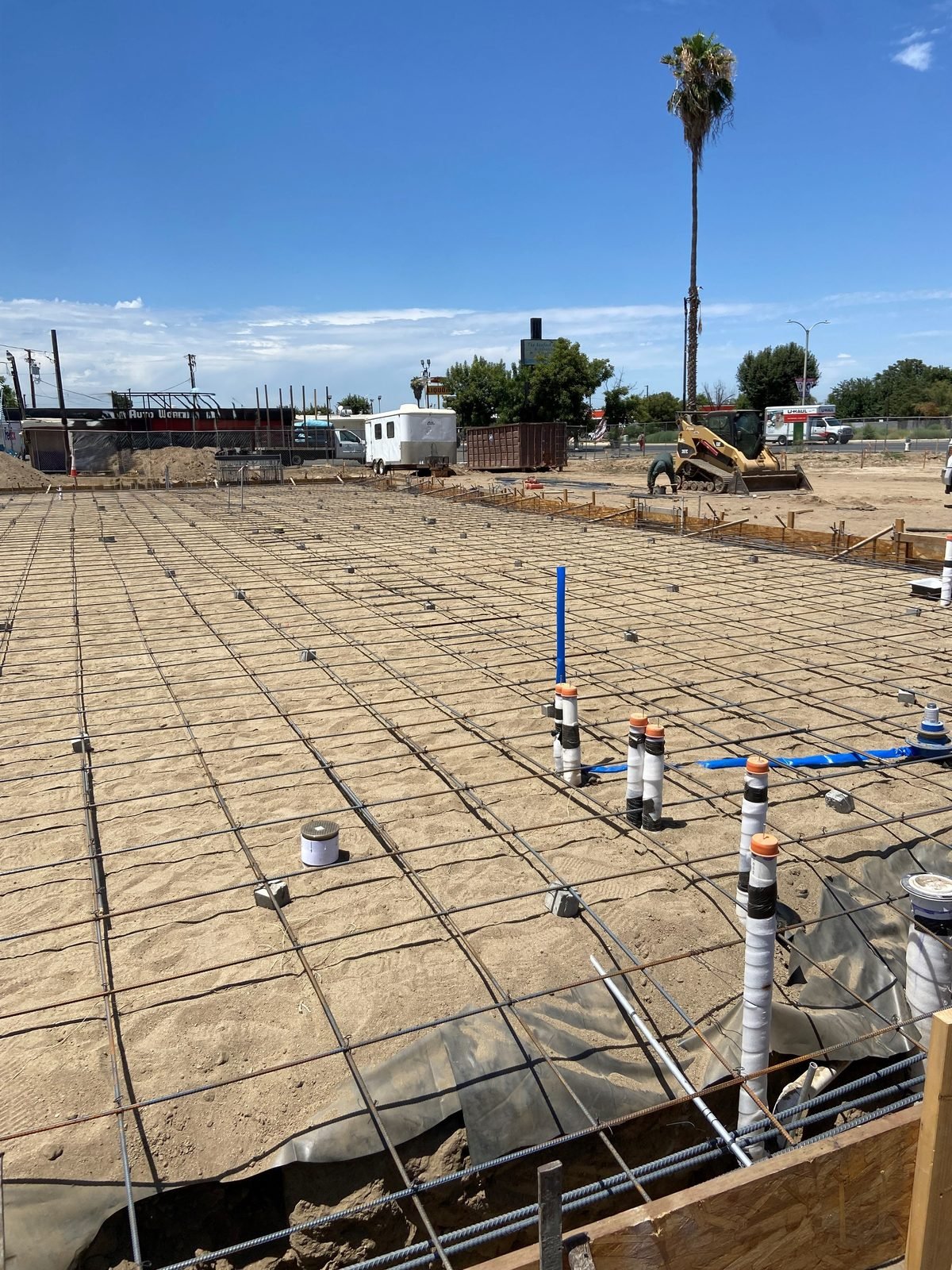 Plumbing and electrical stub-ups set in the slab