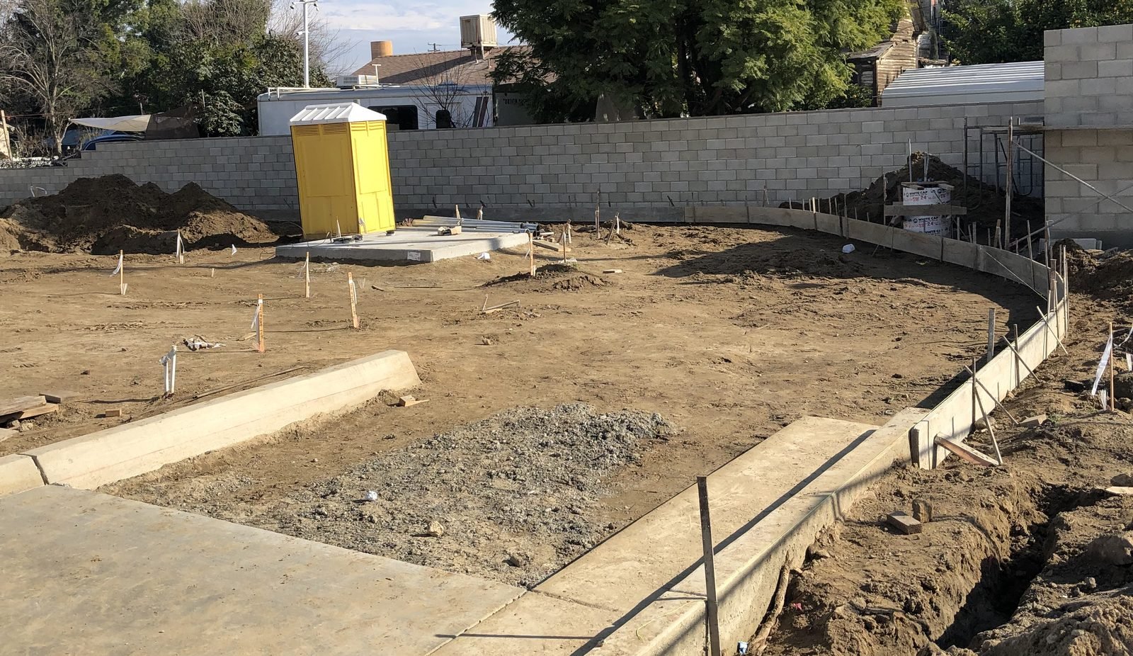 Site cut, graded and formed ahead of paving